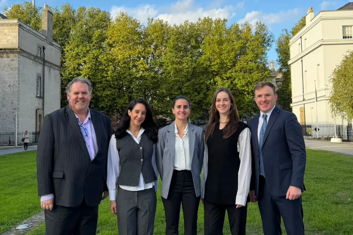 Five members of the EduRelate team standing together outdoors